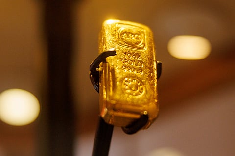 A 10-ounce gold bar is displayed at an ABC Bullion store in Sydney, Australia, on Friday, Jan. 23, 2026. Gold closed in on $5,000 an ounce, with geopolitical risks and renewed threats to the Federal Reserve’s independence supporting a record-breaking rally. Photographer: Brendon Thorne/Bloomberg