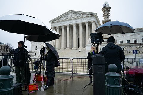 TV crews set up cameras in front of the US Supreme Court in Washington, DC, on Feb. 20.
