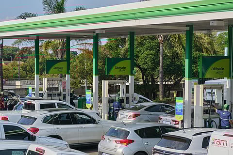 Vehicles line up at a BP Plc gas station in Pretoria, South Africa, on March 31.