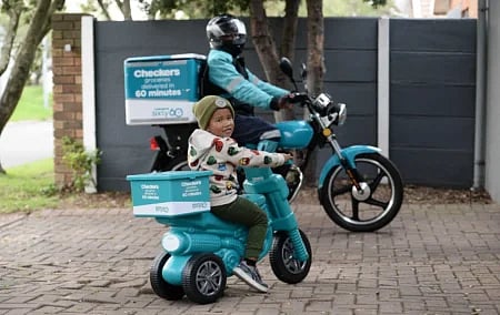 Image: Checkers has positioned gig work as a delivery driver as aspirational by selling plastic Sixty60 scooters for children. 
