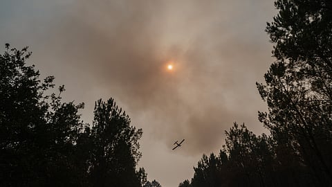 A fire-fighting aircraft above a flare-up during wildfires in Lanton, France, on Wednesday, July 29, 2026. The fire to the west of Bordeaux burned about 420 square kilometres of France’s Gironde region, an area roughly four times the size of Paris, but the situation stabilized over the past few days.