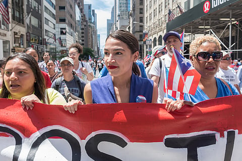 MIDTOWN MANHATTAN, 5TH AVENUE, NEW YORK, UNITED STATES - 2019/06/09: Congresswoman Alexandria Ocasio-Cortez - Thousands of people lined the streets along 5th Avenue in Midtown Manhattan celebrating their Puerto Rican heritage. In its 62nd year, the National Puerto Rican Day Parade is the largest parade of Puerto Rican culture. This year's theme was "Un Pueblo, Muchas Voces" (One Nation, Many Voices) celebrating the diversity of Puerto Rico. (Photo by Gabriele Holtermann-Gorden/Pacific Press/LightRocket via Getty Images)