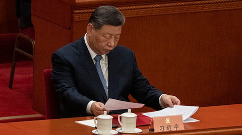 BEIJING, CHINA - MARCH 11: Chinese President Xi Jinping looks at his papers at the closing session of the Chinese People's Political Consultative Conference (CPPCC) at the Great Hall of the People on March 11, 2026 in Beijing, China. The fourth session of the 14th National Committee of the Chinese People's Political Consultative Conference (CPPCC), often referred to in its acronym form as CPCC meetings, begins on Wednesday in Beijing. (Photo by Kevin Frayer/Getty Images)