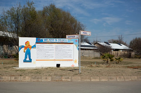 THEMBELIHLE, SOUTH AFRICA - AUGUST 23: Town rules on a sign as you enter Orania on August 23, 2022 in Thembelihle, South Africa. Orania is a white Afrikaner-only town located along the Orange River in the Karoo region of the Northern Cape province. (Photo by Gallo Images/Misha Jordaan)