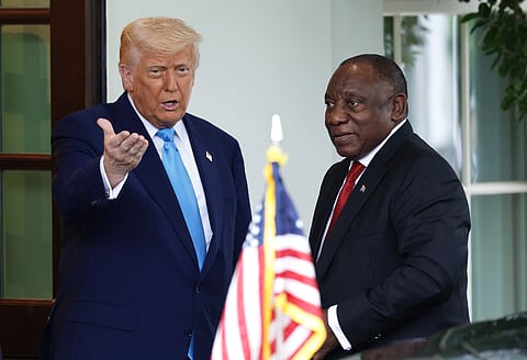 WASHINGTON, DC - MAY 21: U.S. President Donald Trump (L) greets President of South Africa Cyril Ramaphosa as he arrives to the White House on May 21, 2025 in Washington, DC. Relations between the two countries have been strained since Trump signed an executive order in February that claimed white South Africans are the victims of government land confiscation and race-based “genocide” while admitting some of those Afrikaners as refugees to the United States. Trump also halted all foreign aid to South Africa and expelled the country’s Ambassador to the U.S. Ebrahim Rasool. (Photo by Alex Wong/Getty Images)