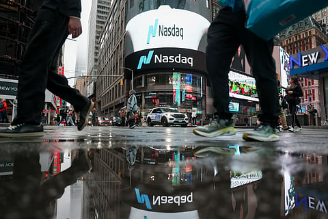 Pedestrians outside the Nasdaq MarketSite in New York, US, on Friday, Oct. 16, 2026. City Therapeutics Inc., an early-stage developer of RNAi-based drugs, raised $200 million in a US initial public offering priced at the mid-point of its marketed range. Photographer: Michael Nagle/Bloomberg via Getty Images