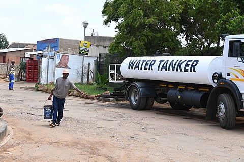 PRETORIA, SOUTH AFRICA - FEBRUARY 07: Elvis Nkuna fetch water from a community water tank in Mamelodi on February 07, 2024 in Pretoria, South Africa. It is reported that residents and businesses in the City of Tshwane have been warned about the possibility of running out of water. (Photo by Gallo Images/Lefty Shivambu)