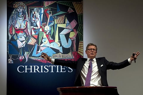 Auctioneer Jussi Pylkkanen calls for final bids before dropping the gavel as he sells Pablo Picasso's "Les femmes d'Alger (Version 'O')" (Women of Algiers) at Christie's Auction House in the Manhattan borough of New York May 11, 2015. The auction house had estimated the 1955 cubist oil "Les femmes d'Alger (Version "O")" would sell for about $140 million, but several bidders competing via telephone drove the winning bid to $160 million, for a final price of $179,365,000 including Christie's commission of just over 12 percent. REUTERS/Carlo Allegri      