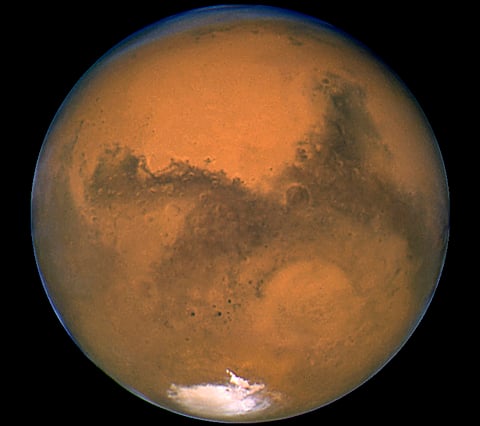 The planet Mars is seen in an image from NASA's Hubble Space Telescope taken August 27, 2003. Scientists have found the first evidence that briny water may flow on the surface of Mars during the planet's summer months, a paper published on Monday showed.  REUTERS/NASA/Handout via Reuters  THIS IMAGE HAS BEEN SUPPLIED BY A THIRD PARTY. IT IS DISTRIBUTED, EXACTLY AS RECEIVED BY REUTERS, AS A SERVICE TO CLIENTS. FOR EDITORIAL USE ONLY. NOT FOR SALE FOR MARKETING OR ADVERTISING CAMPAIGNS