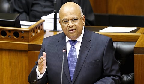 South Africa's Finance Minister Pravin Gordhan delivers his 2014 budget address at Parliament in Cape Town in this February 26, 2014 file photo. President Jacob Zuma has appointed Gordhan finance minister, a statement said on December 13, 2015, handing South Africa its third finance chief in a week and giving way to a wave of criticism of his last choice and selling frenzy in the markets. REUTERS/Mike Hutchings/Files