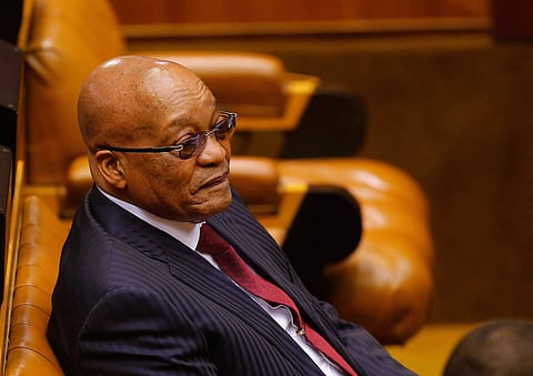 President Jacob Zuma looks on as members of Julius Malema's Economic Freedom Fighters (EFF) party raise objections before being evicted from Parliament during his question and answer session in Cape Town, South Africa, May 17, 2016.  REUTERS/Mike Hutchings