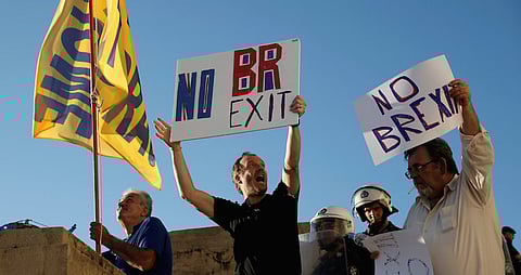 Anti-government demonstrators hold placards reading "No Brexit" during a protest outside the parliament in Athens, Greece. REUTERS/Alkis Konstantinidis