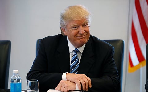 Republican presidential nominee Donald Trump listens during a round table discussion on security at Trump Tower  in the Manhattan borough of New York, U.S., August 17, 2016. REUTERS/Carlo Allegri