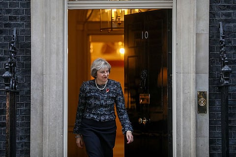 Theresa May, U.K. prime minister, walks out of 10 Downing Street to greet Viktor Orban, Hungary's prime minister, in London, U.K., on Wednesday, Nov. 9, 2016. May congratulated Donald Trump on a "hard fought campaign" and said the U.K. will remain, strong and close partners on trade, security and defense with the U.S. Photographer: Simon Dawson/Bloomberg