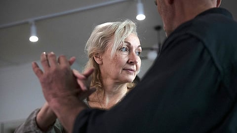 Oxana Slupska is an art teacher who’s been learning to tango for several years. She and her partner never left Bucha. Photographer: Andrew Kravchenko for Bloomberg Businessweek