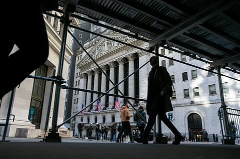 Pedestrians in front of the New York Stock Exchange (NYSE) in New York, US, on Friday, Feb. 16, 2024. Wall Street is ending the week on a bit of a sour note, with stocks and bonds falling after economic data continued to fuel speculation the Federal Reserve will be in no rush to cut interest rates.