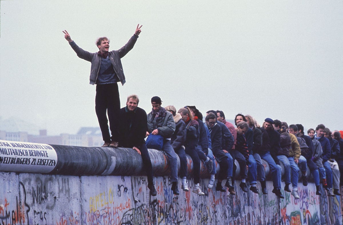 File Photo: West Germans Celebrate The Unification Of Berlin Atop The Berlin Wall During The Collapse Of Communism In East Berlin On November 12, 1989. November, 1999 Marks The 10Th Anniversary Of The Fall Of The Berlin Wall. East Germany's Communist Government Erected The Berlin Wall In August 1961. The Wall Fell After Weeks Of Massive Anti-Government Protests On November 9, 1989. The Fall Of The Berlin Wall Is Often Described As The "End Of The Cold War." East German Border Guards Shot 77 People Who Tried To Escape To The West Over The Wall During The Course Of Its Existence. (Photo By Stephen Jaffe/Getty Images)