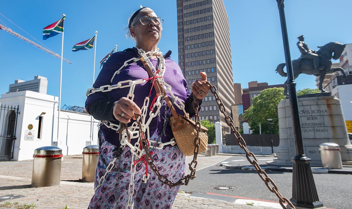 CAPE TOWN, SOUTH AFRICA - NOVEMBER 21: Activist Venetia Orgill chained herself to Parliament ,Cape Town on November 21, 2025 in Cape Town, South Africa. It is reported that South African women's rights groups are calling for nationwide protests to demand that Gender-Based Violence (GBV) be declared a national disaster. (Photo by Gallo Images/Brenton Geach)