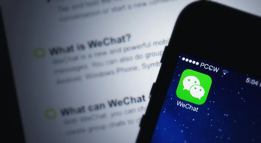 Tencent’s WeChat displayed on an iPhone (Photographer: Brent Lewin/Bloomberg)