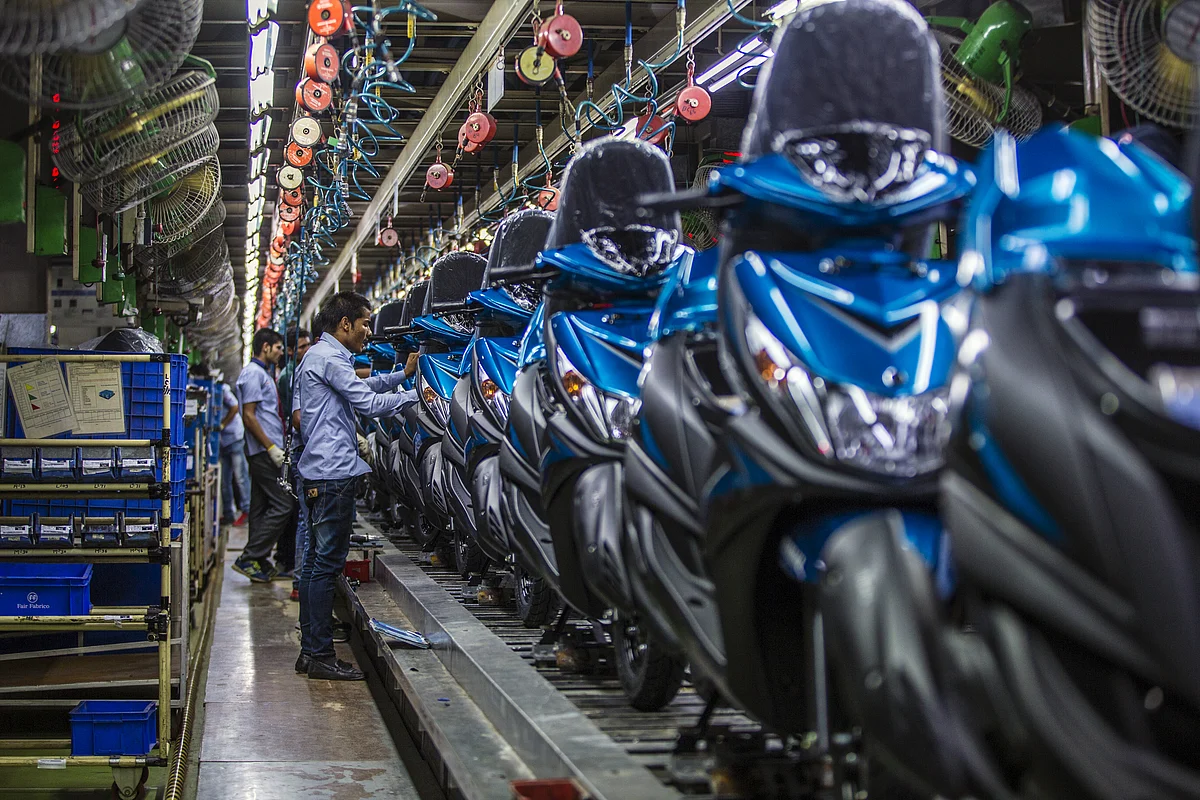 Workers assemble scooters at the Yamaha Motor Co. plant in Surajpur, Uttar Pradesh. (Photographer: Prashanth Vishwanathan/Bloomberg)