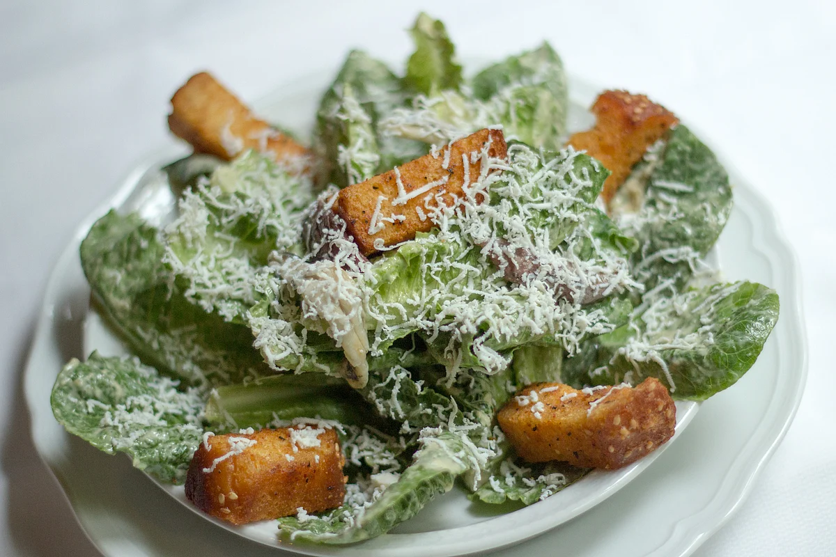 Caesar salad served at a restaurant is shown in an arranged photograph. (Photographer: Philip Lewis/Bloomberg)
