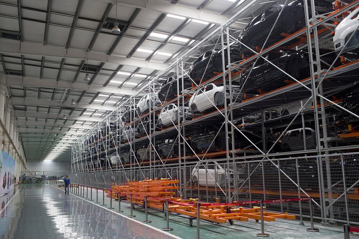 

An employee walks past frames for the BYD Co. S6 sport-utility vehicle (SUV) at the company’s assembly plant in the Pingshan district of Shenzhen, China (Photographer: Brent Lewin/Bloomberg)