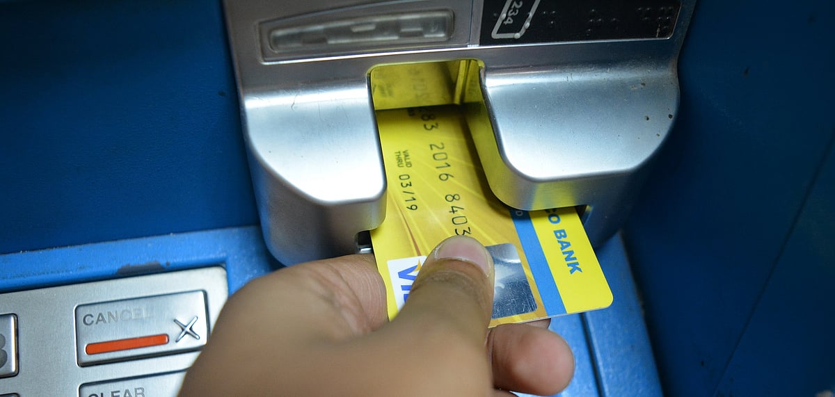 <div class="paragraphs"><p>A person swiping card at UCO Bank ATM, CST Branch, Mumbai. (Source: NDTV Profit)</p></div>