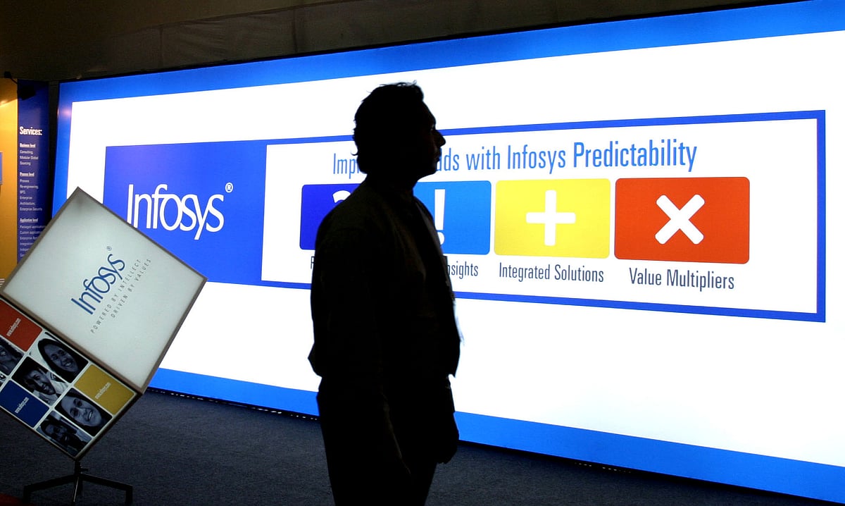 A delegate walks past an Infosys Technologies stall. (Photographer: Namas Bhojani/Bloomberg News)&nbsp;