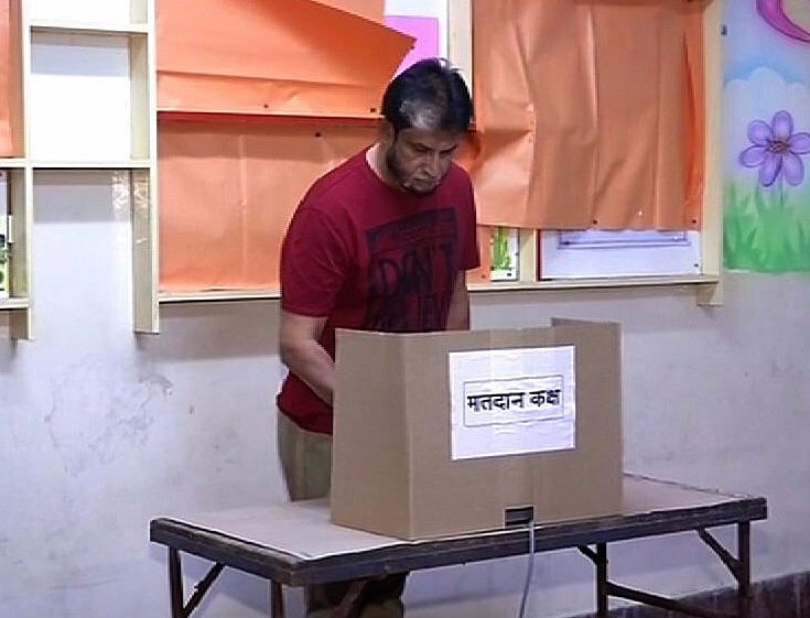 Cricketer Sandeep Patil votes.