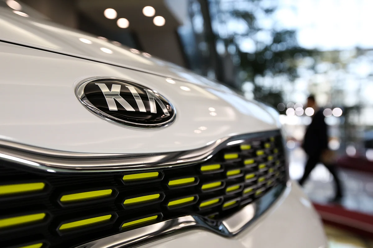 The Kia Motors Corp. logo is displayed on a vehicle in the lobby of the company’s headquarters in Seoul, South Korea. (Photographer: SeongJoon Cho/Bloomberg) 