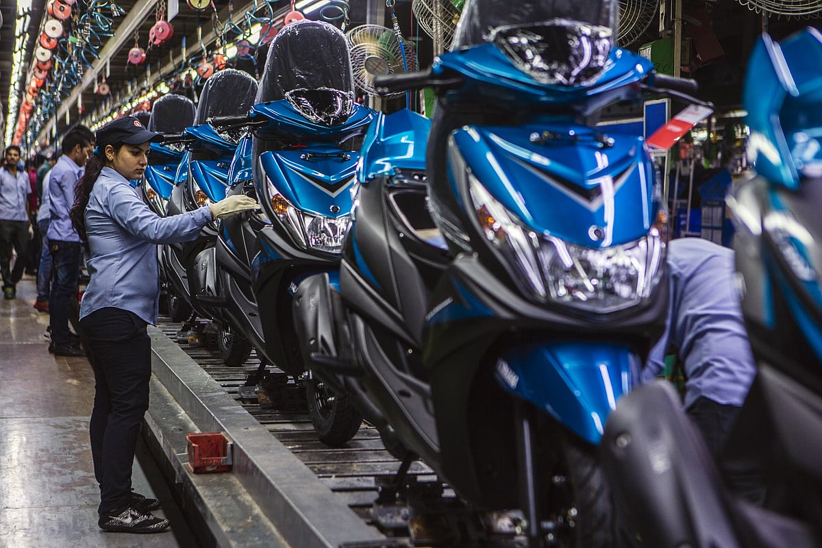 Workers assemble scooters at the Yamaha Motor Co. plant in Surajpur, Uttar Pradesh. (Photographer: Prashanth Vishwanathan/Bloomberg) 
