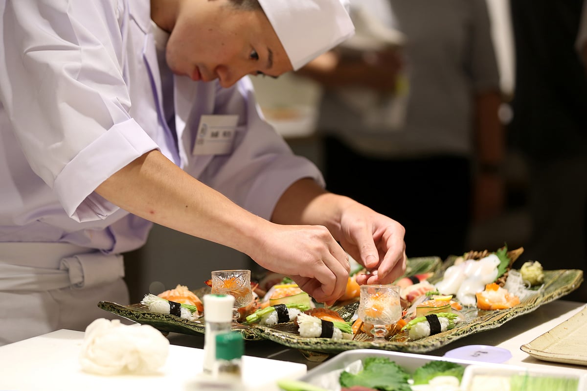 A sushi chef puts final touches on his creative sushi dish  in Tokyo, Japan. (Photographer: Yuriko Nakao/Bloomberg)
