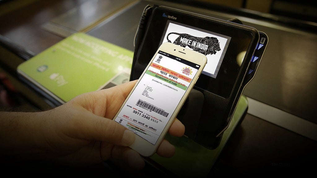 A person shows the Aadhaar app on his mobile phone (Photo: The Quint)