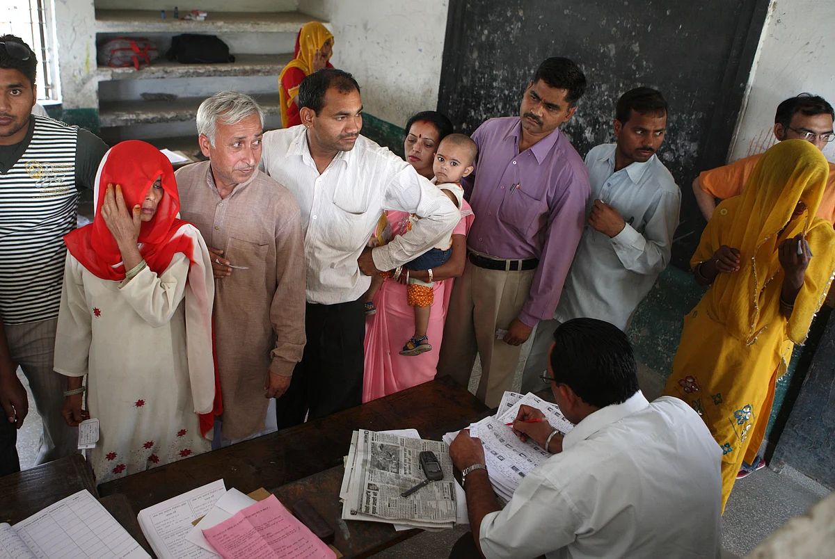 Indian voters register to get their polling slips in Ghaziabad, India. (Photographer: Pankaj Nangia/Bloomberg News)