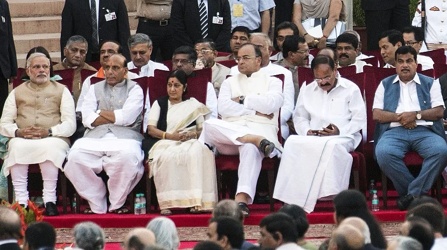 Narendra Modi, Rajnath Singh, Sushma Swaraj, Arun Jaitley, Venkaiah Naidu, and Nitin Gadkari with the rest of the Union Council of Ministers, at the NDA government’s swearing-in ceremony, on May 26, 2014. (Photographer: Udit Kulshrestha/Bloomberg) 