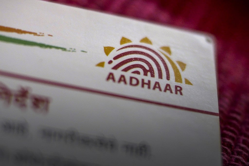 

An Aadhaar biometric identity card, issued by the Unique Identification Authority of India (UIDAI). (Photographer: Dhiraj Singh/Bloomberg)