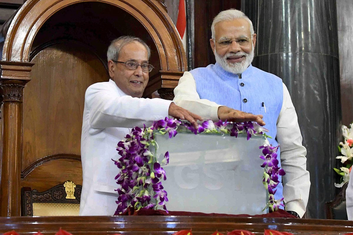 Then President Pranab Mukherjee and Prime Minister Narendra Modi in the Central Hall of Parliament in New Delhi, on June 30, 2017. (Photograph: PTI)