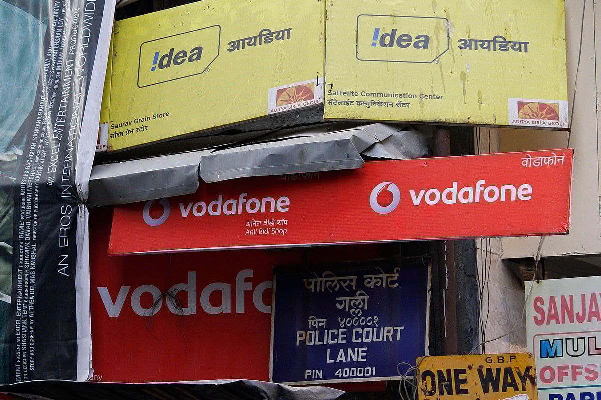 Advertisements for Vodafone India Ltd. and Idea Cellular Ltd. are displayed on a street in Mumbai, India (Photographer: Dhiraj Singh/Bloomberg) &nbsp;
