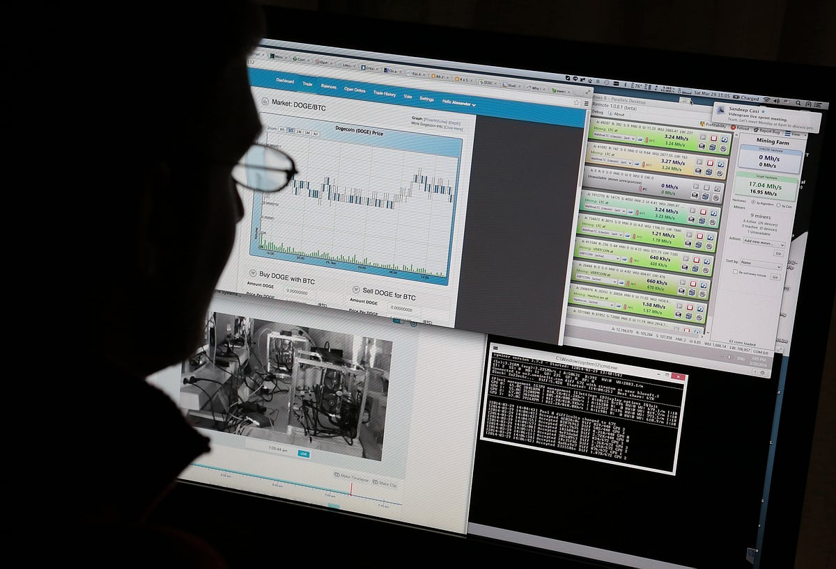 A  bitcoin miner is silhouetted as he uses his computer that is set up to mine the crypto-currency at his home in Tokyo, Japan (Photographer: Yuriko Nakao/Bloomberg)