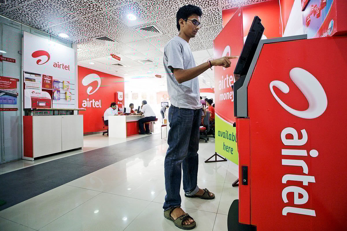 

A customer uses a Bharti Airtel Ltd. automated teller machine (Photographer: Kuni Takahashi/Bloomberg)