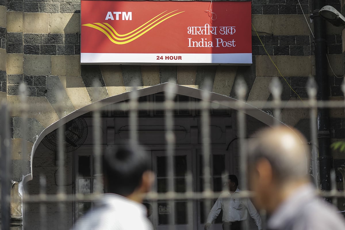 Signage for India Post’s automated teller machine services is displayed at the postal operator’s head office in Mumbai. (Photographer: Dhiraj Singh/Bloomberg)