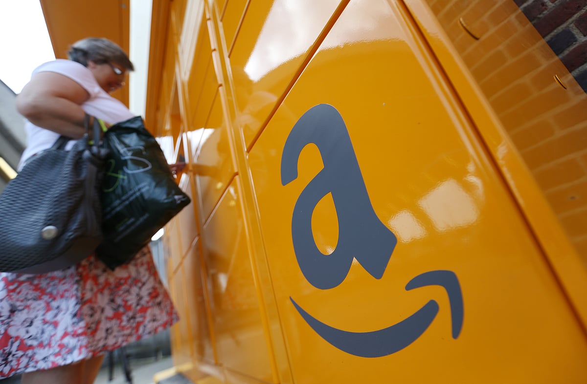 The Amazon logo sits on an Amazon.com Inc. pickup and collect locker. (Photographer: Chris Ratcliffe/Bloomberg)
