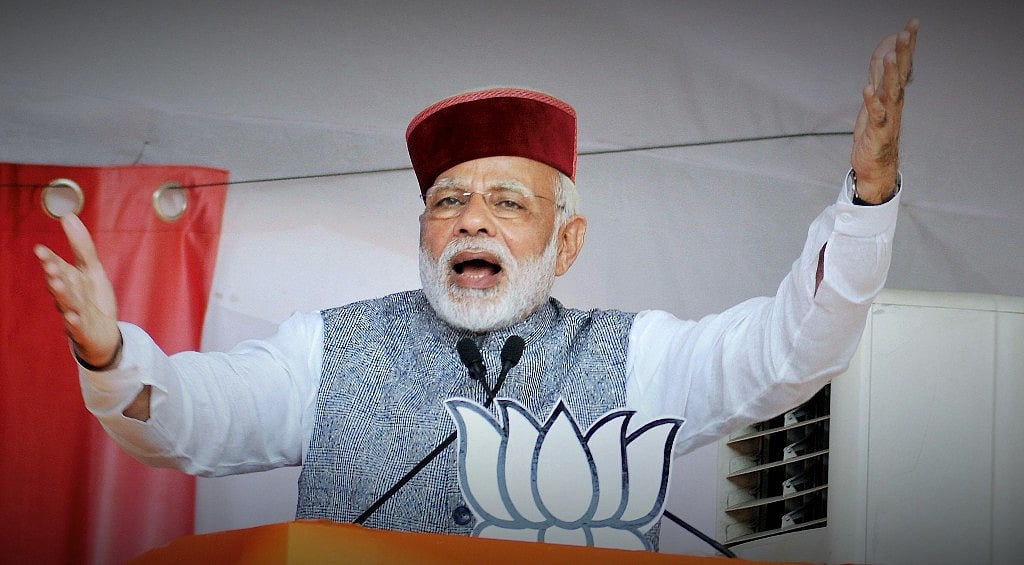 Prime Minister Narendra Modi waves at crowd during BJP Parivartan Rally at Rait near Dharamsala on Saturday. (Source: PTI)