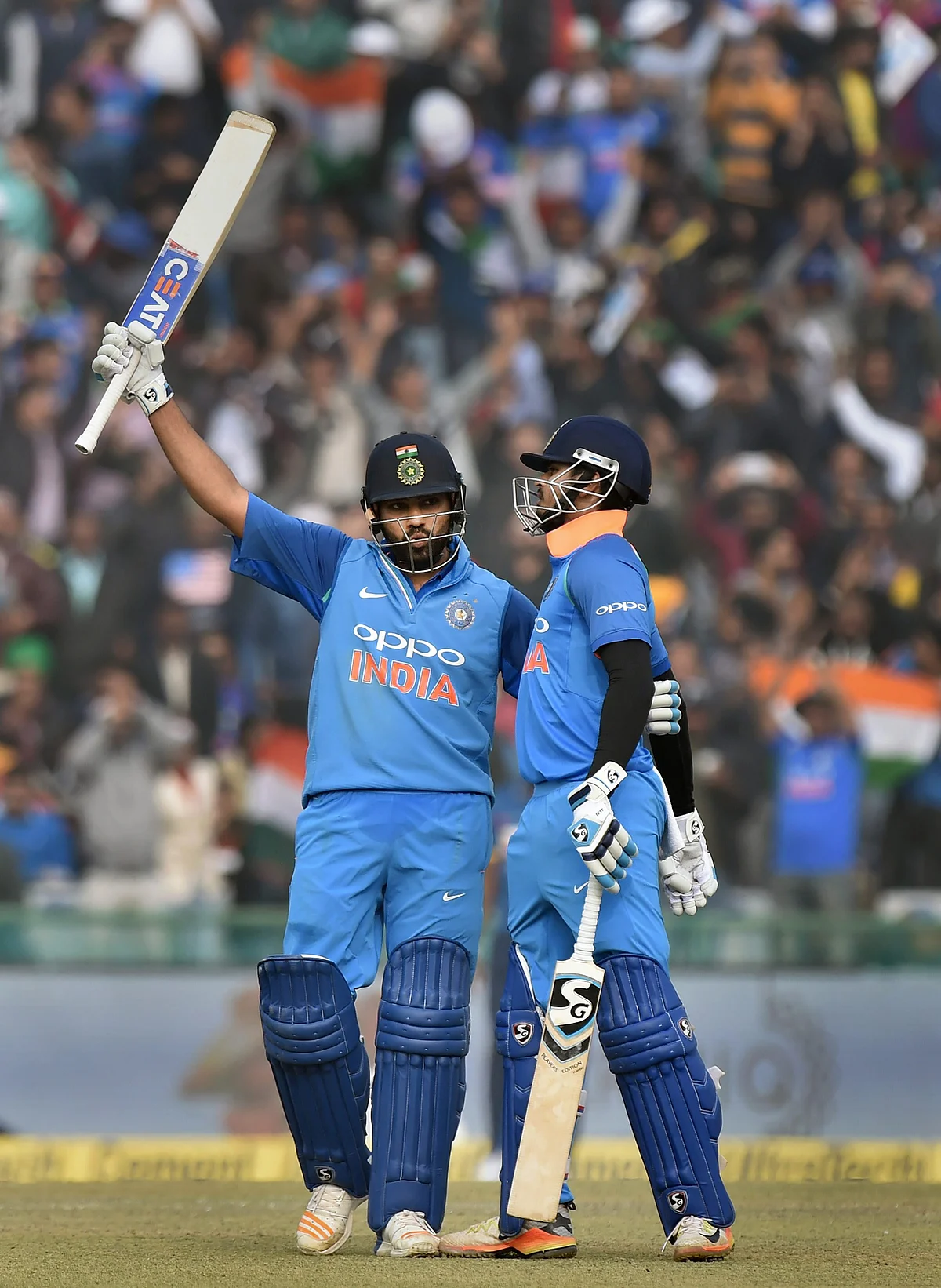 India’s captain Rohit Sharma celebrate his century as Shreyas Iyer greets him, during the second ODI cricket match against Sri Lanka in Mohali, on Wednesday. (Photographer: Manvender Vashist/PTI)