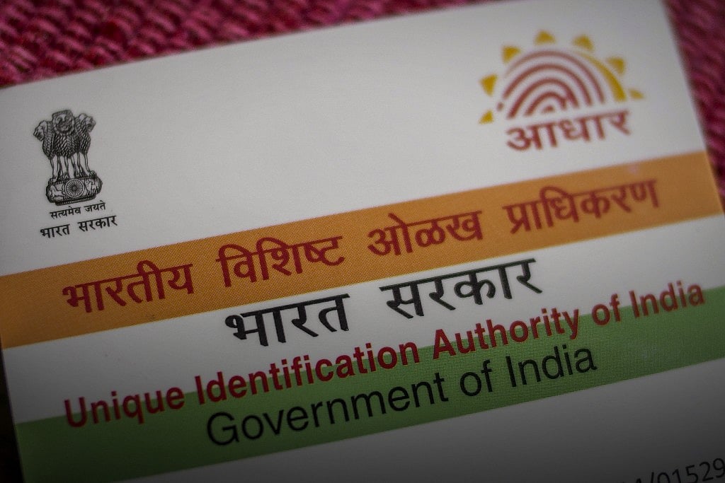 

An Aadhaar biometric identity card, issued by the Unique Identification Authority of India (UIDAI), is arranged for a photograph in Mumbai, India (Photographer: Dhiraj Singh/Bloomberg)