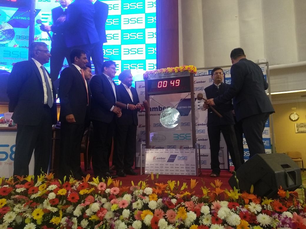 The management of Amber Enterprises Ltd. after hitting a bell during a ceremony for the company’s listing. (Image Source: BloombergQuint)