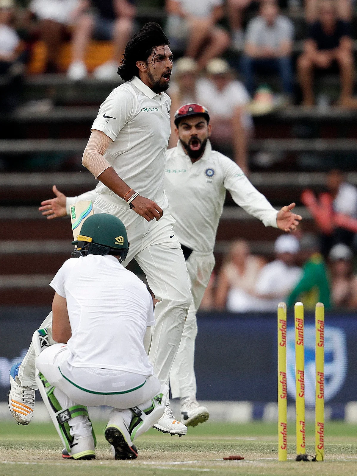 India’s bowler Ishant Sharma, center, with captain Virat Kohli, rear, reacts after bowling South Africa’s captain Faf du Plessis for 2 runs on the fourth day of the third cricket test match between South Africa and India at the Wanderers Stadium in Johannesburg, South Africa, on January 27, 2018. (Photograph: AP/PTI)