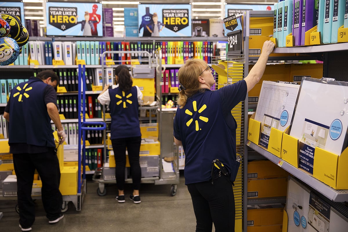 Employees restock shelves of school supplies at a Wal-Mart Stores Inc. location in Burbank, California, U.S. (Photographer: Patrick T. Fallon/Bloomberg) &nbsp;