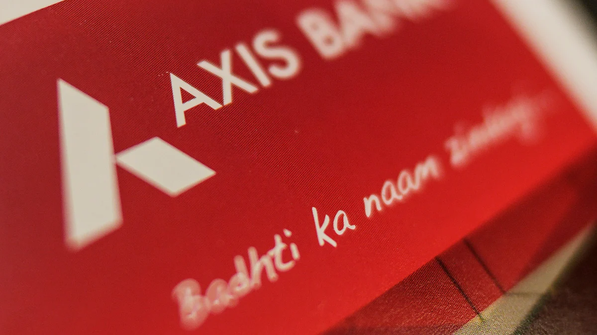 An Axis Bank Ltd. logo sits on a brochure inside bank’s branch in Mumbai, India. (Photographer: Dhiraj Singh/Bloomberg)