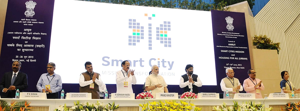 Prime Minister Narendra Modi at the launch of the Smart Cities Mission, in New Delhi on June 25, 2015. (Photograph: PIB)<a href="https://www.facebook.com/sharer/sharer.php?u=http://pibphoto.nic.in/photo//2015/Jun/l2015062566979.jpg"><i><br></i></a>
